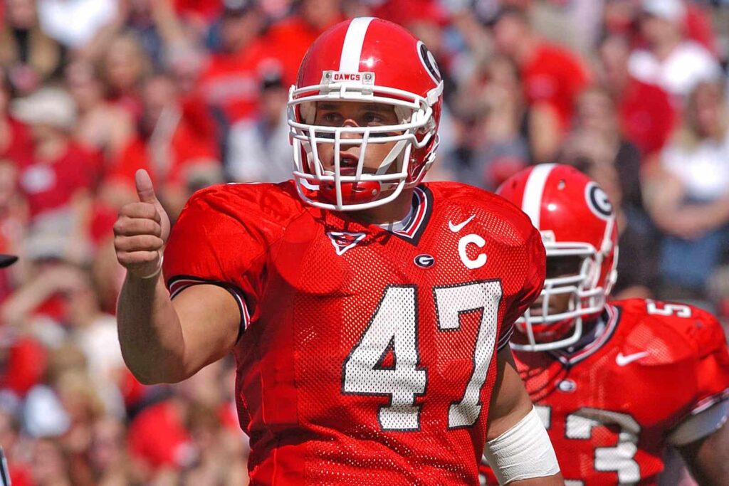 David Pollack giving a thumbs up while in full football pads