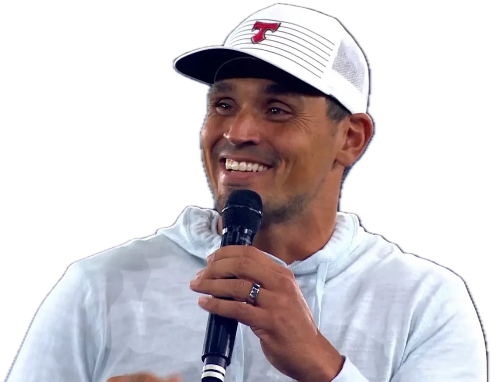 David Pollack smiling and speaking into a microphone